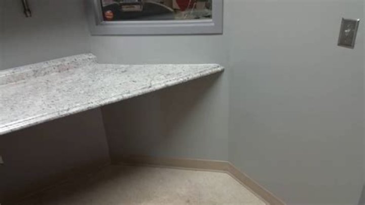 How do you attach a countertop to a wall without cabinets?